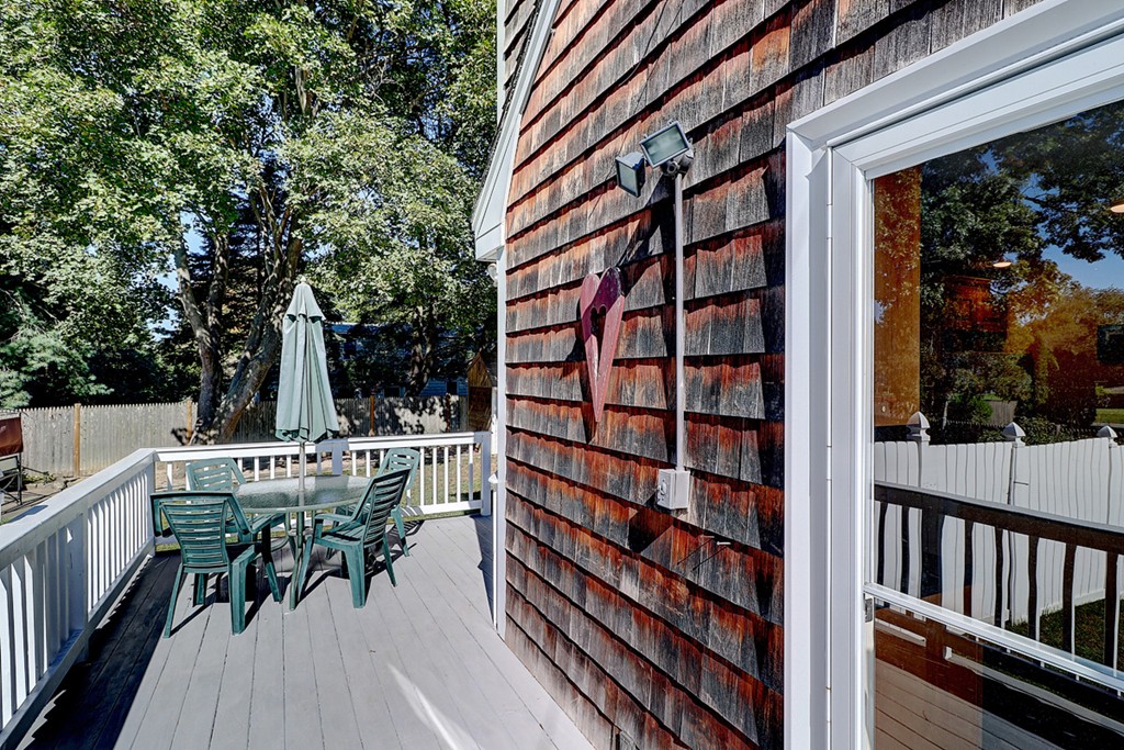 70 Linden Road Seekonk, MA 02771 - Photo 5 of 25 a view of balcony with chairs and table and chairs