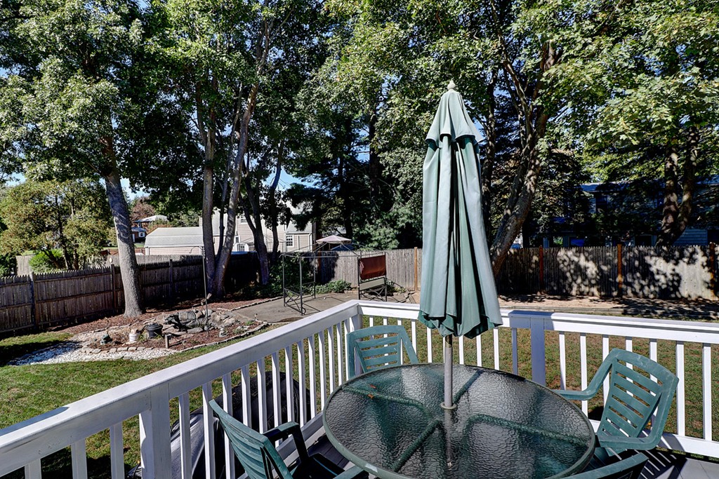 70 Linden Road Seekonk, MA 02771 - Photo 6 of 25 a view of a patio with two chairs and a table