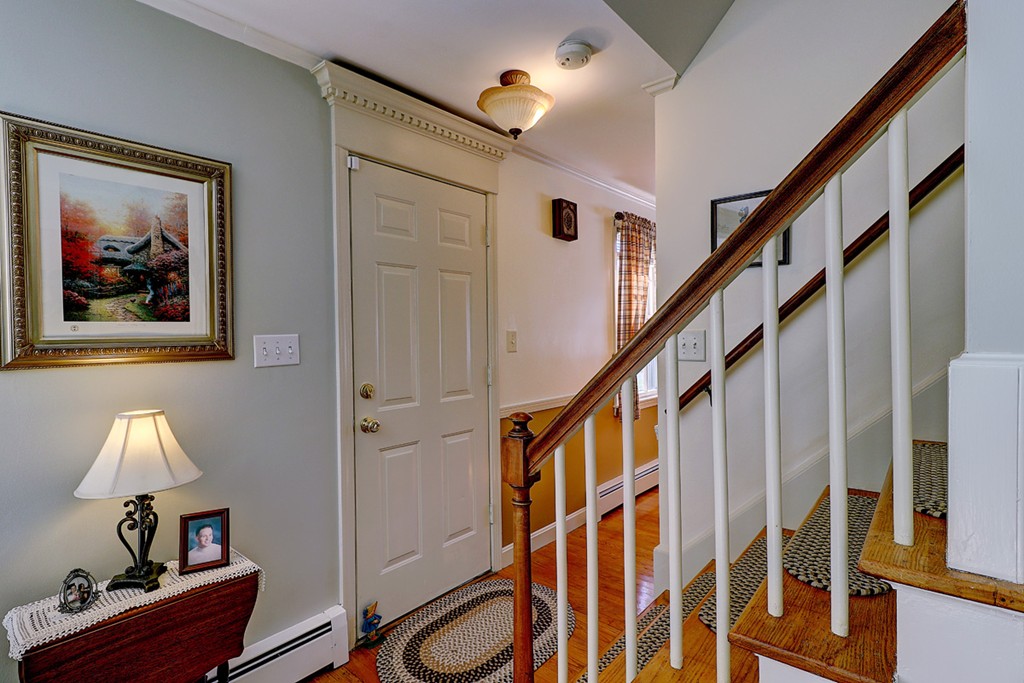 70 Linden Road Seekonk, MA 02771 - Photo 7 of 25 a view of entryway with wooden floor and door