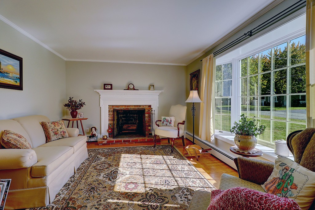 70 Linden Road Seekonk, MA 02771 - Photo 9 of 25 a living room with furniture fireplace and a large window