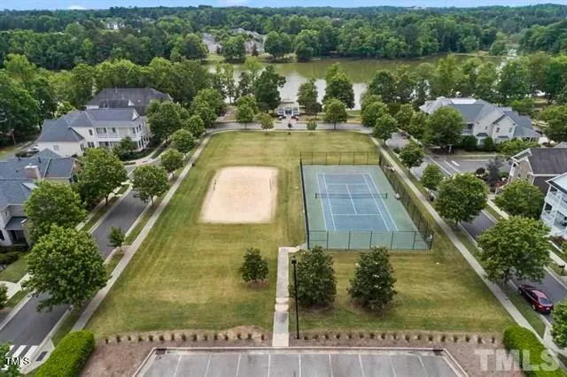 an aerial view of a house with a lake view