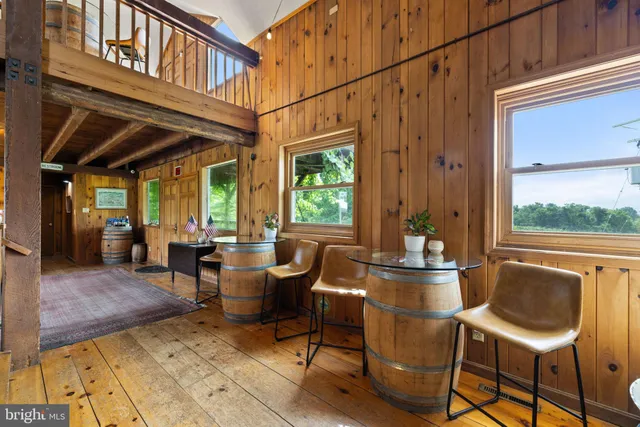 a view of entryway with wooden floor and stairs