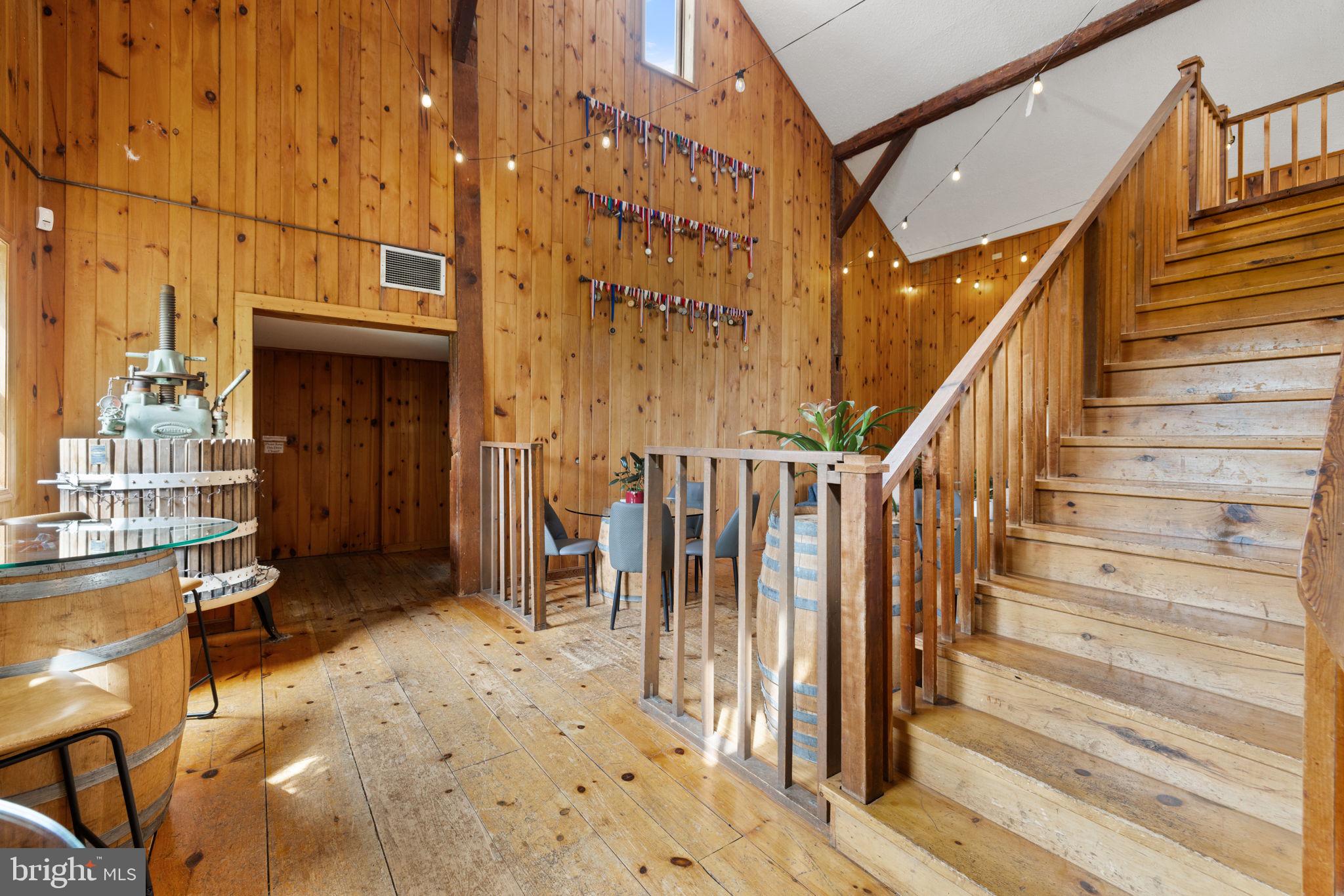 3659 South Ox Road Edinburg, VA 22824 - Photo 17 of 66 a view of entryway with wooden floor and stairs