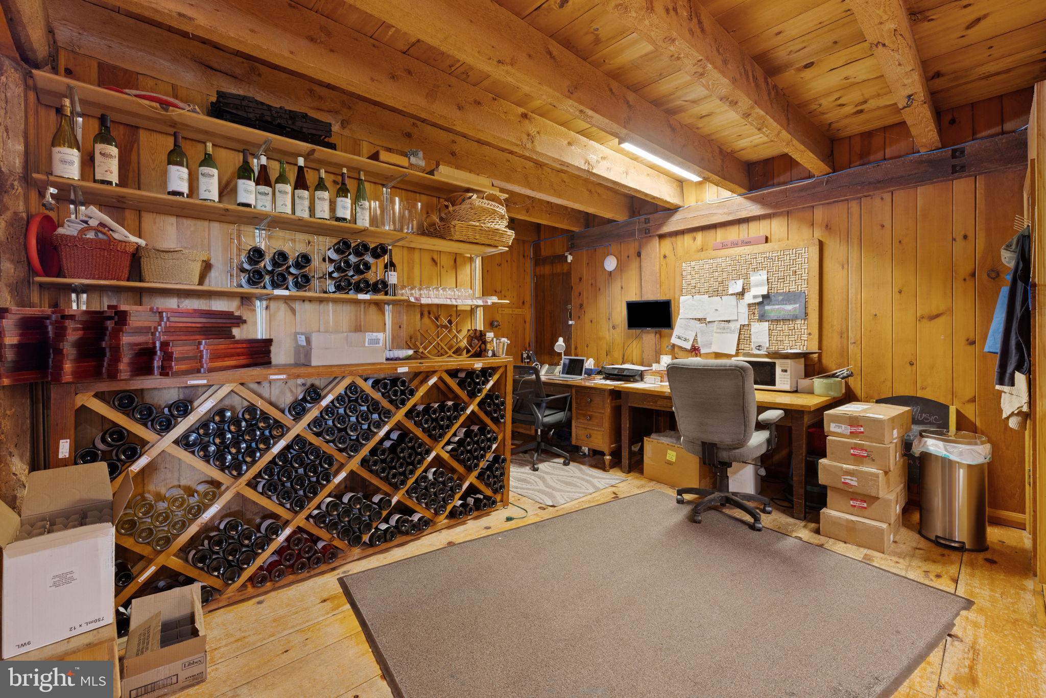 3659 South Ox Road Edinburg, VA 22824 - Photo 25 of 66 a room with lots of wooden furniture and windows