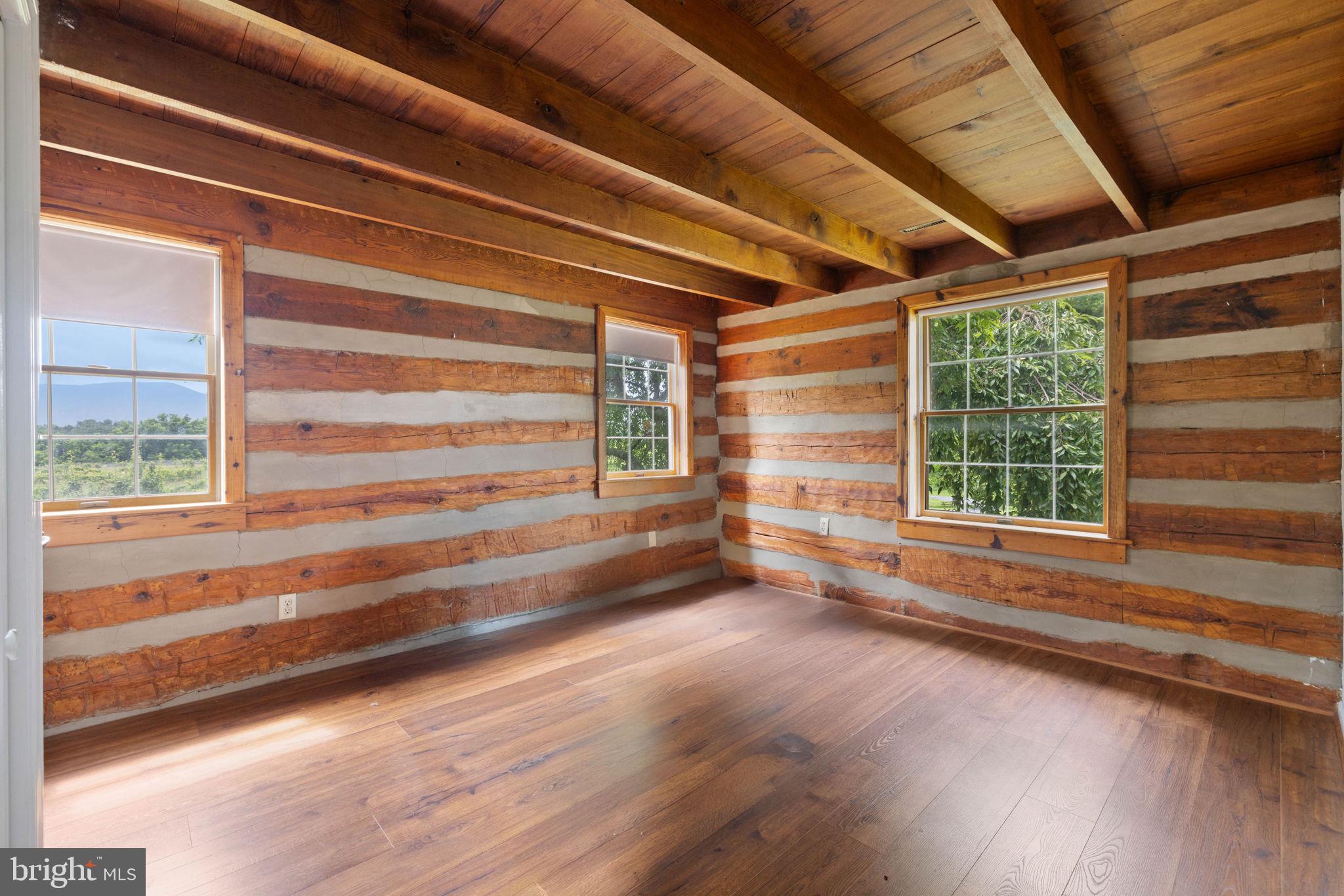 3659 South Ox Road Edinburg, VA 22824 - Photo 44 of 66 a view of empty room with wooden floor and fan
