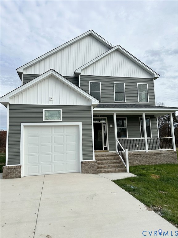 63 Hatcher Road Powhatan, VA 23139 - Photo 13 of 13 a front view of a house with a yard and garage