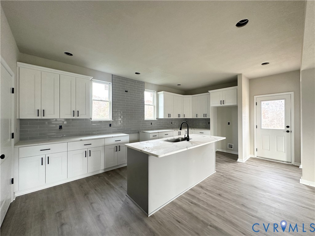63 Hatcher Road Powhatan, VA 23139 - Photo 5 of 13 a kitchen with a sink stove and cabinets