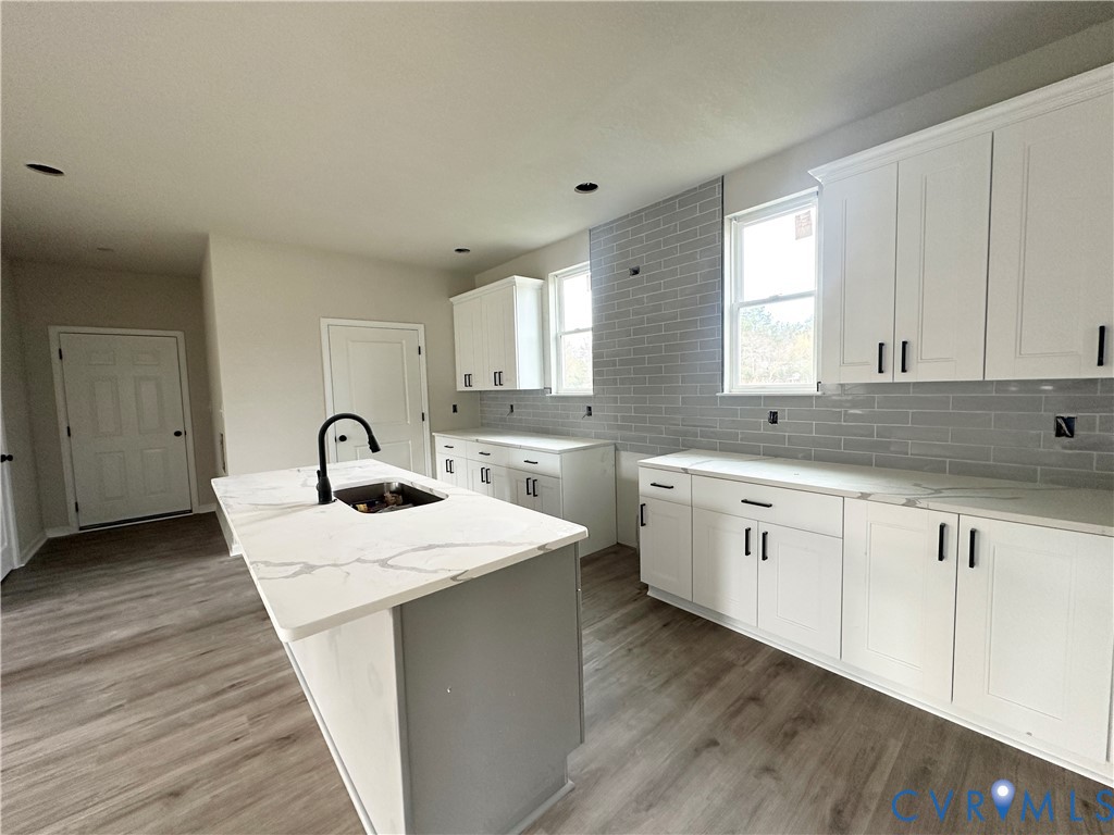 63 Hatcher Road Powhatan, VA 23139 - Photo 6 of 13 a kitchen with sink and mirror