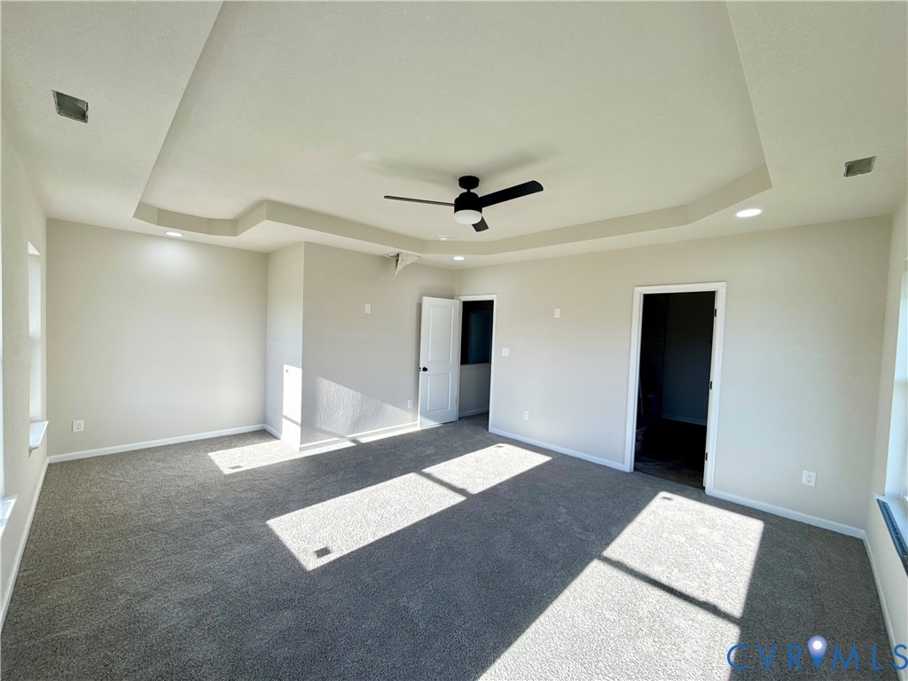 63 Hatcher Road Powhatan, VA 23139 - Photo 7 of 13 a view of an empty room with a ceiling fan