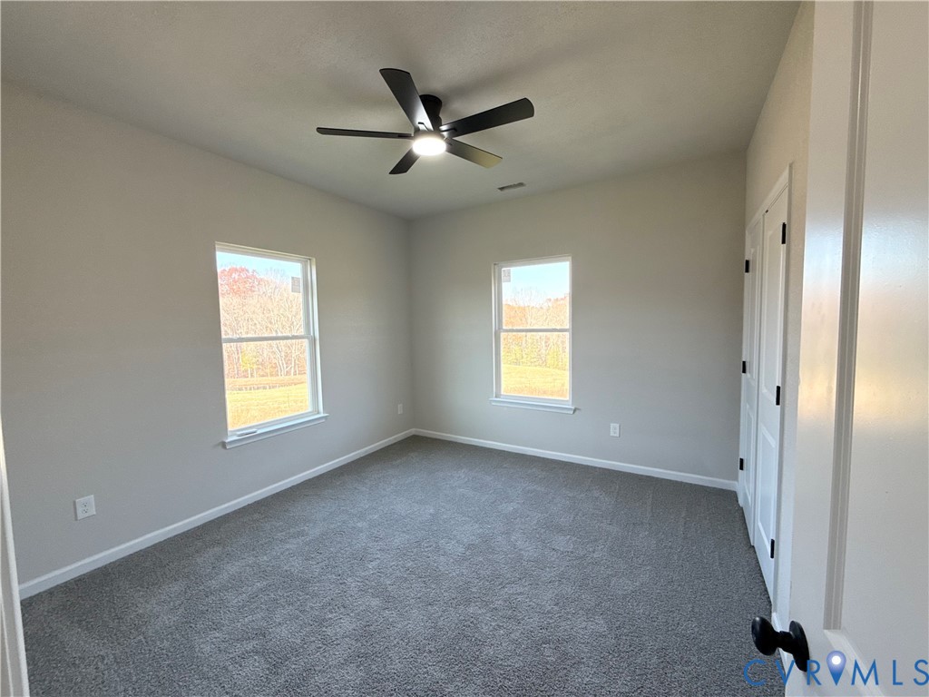 63 Hatcher Road Powhatan, VA 23139 - Photo 10 of 13 a view of an empty room with a window