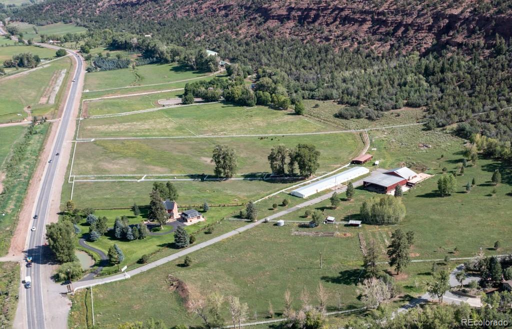 131 Citadel, Unit RESIDE Ridgway, CO 81432 - Photo 12 of 25 a view of a lake with a yard