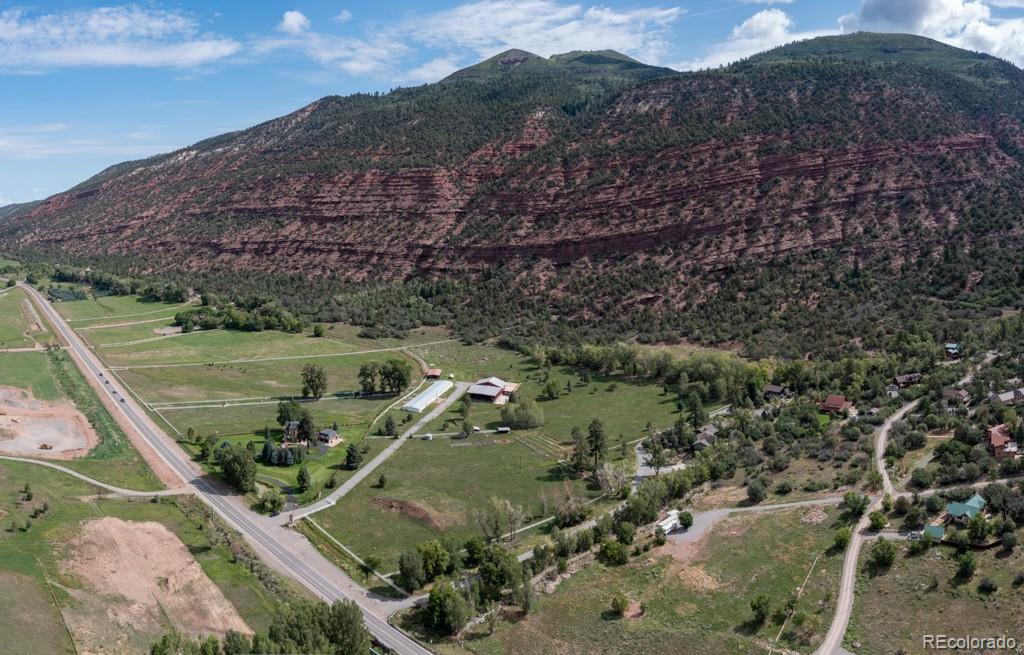 131 Citadel, Unit RESIDE Ridgway, CO 81432 - Photo 14 of 25 a view of a forest with a yard