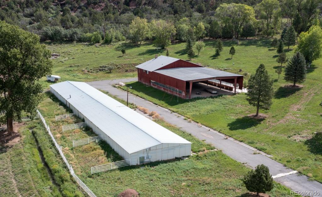 131 Citadel, Unit RESIDE Ridgway, CO 81432 - Photo 17 of 25 a view of a wooden deck and a yard