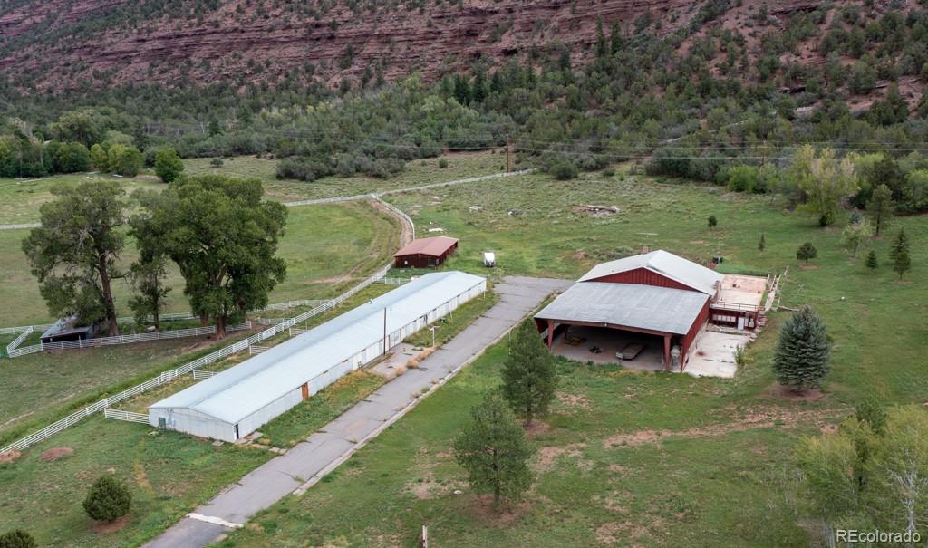 131 Citadel, Unit RESIDE Ridgway, CO 81432 - Photo 20 of 25 a aerial view of a house with a yard