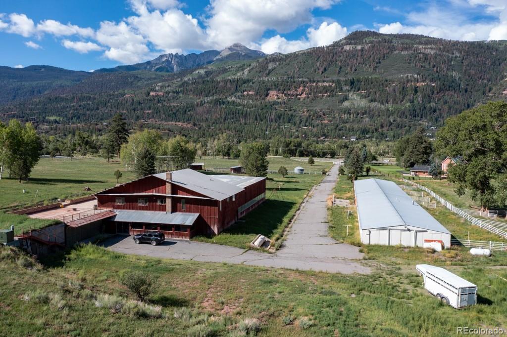 131 Citadel, Unit RESIDE Ridgway, CO 81432 - Photo 2 of 25 an aerial view of a house with a yard basket ball court and outdoor seating