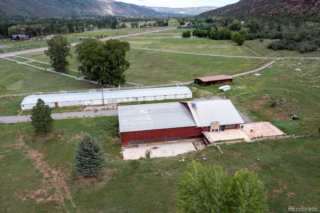 131 Citadel, Unit RESIDE Ridgway, CO 81432 - Photo 21 of 25 a view of a lake with a yard