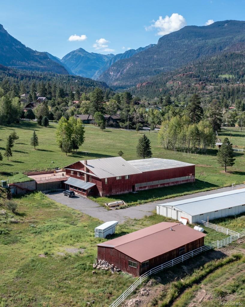 131 Citadel, Unit RESIDE Ridgway, CO 81432 - Photo 5 of 25 an aerial view of a house with pool and a view of a lake