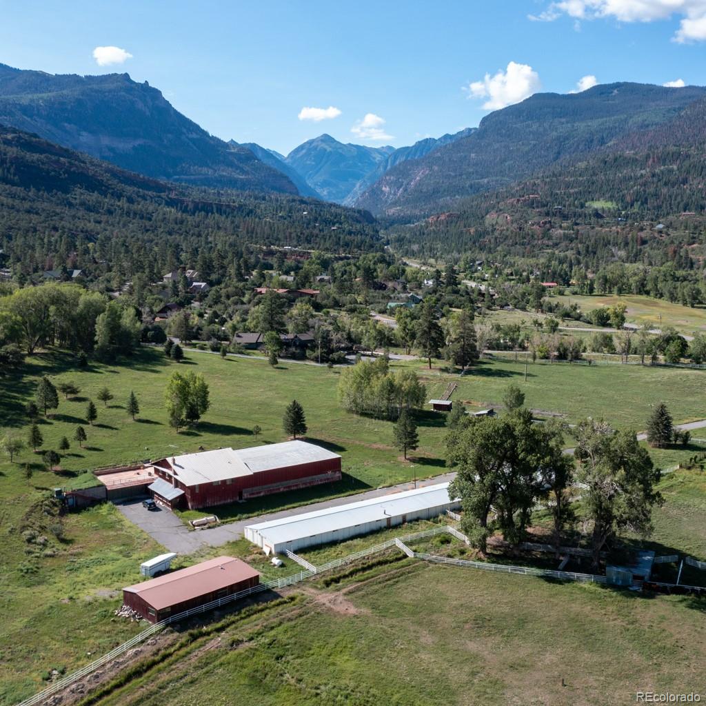 131 Citadel, Unit RESIDE Ridgway, CO 81432 - Photo 6 of 25 an aerial view of a house with a lake view