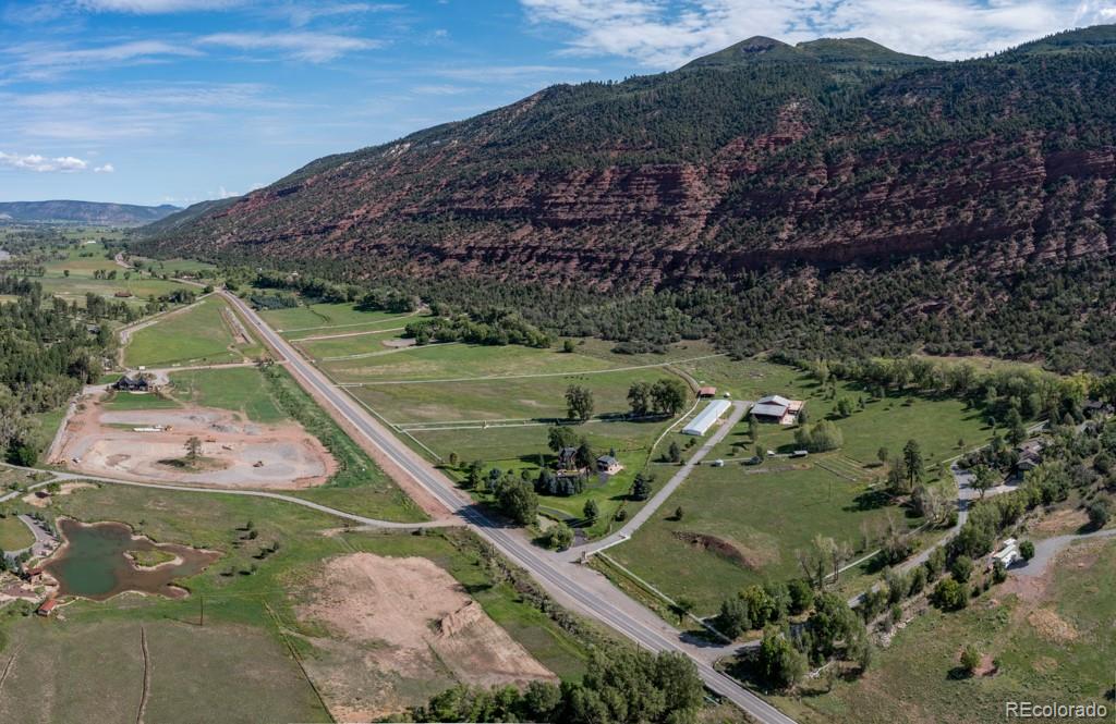 131 Citadel, Unit RESIDE Ridgway, CO 81432 - Photo 9 of 25 a view of a lake in middle of the town