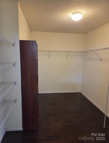 a view of an empty walk in closet