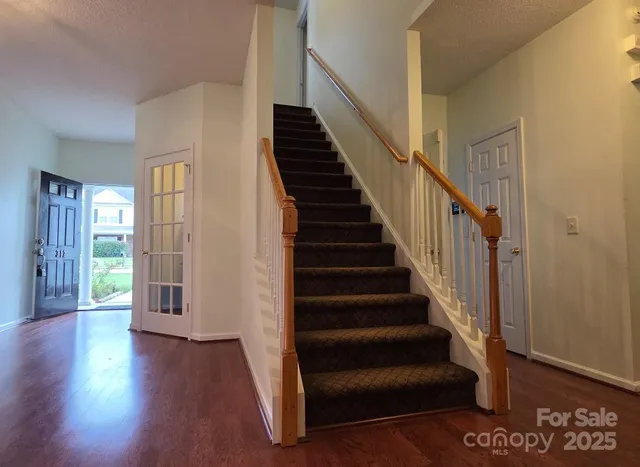 a view of an entryway with wooden floor