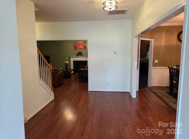 a view of livingroom with hardwood floor and a ceiling fan