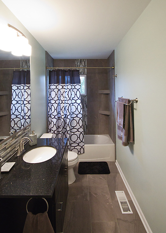 426 Thoria Road Batavia, IL 60510 - Photo 6 of 8 a bathroom with a sink a toilet and shower