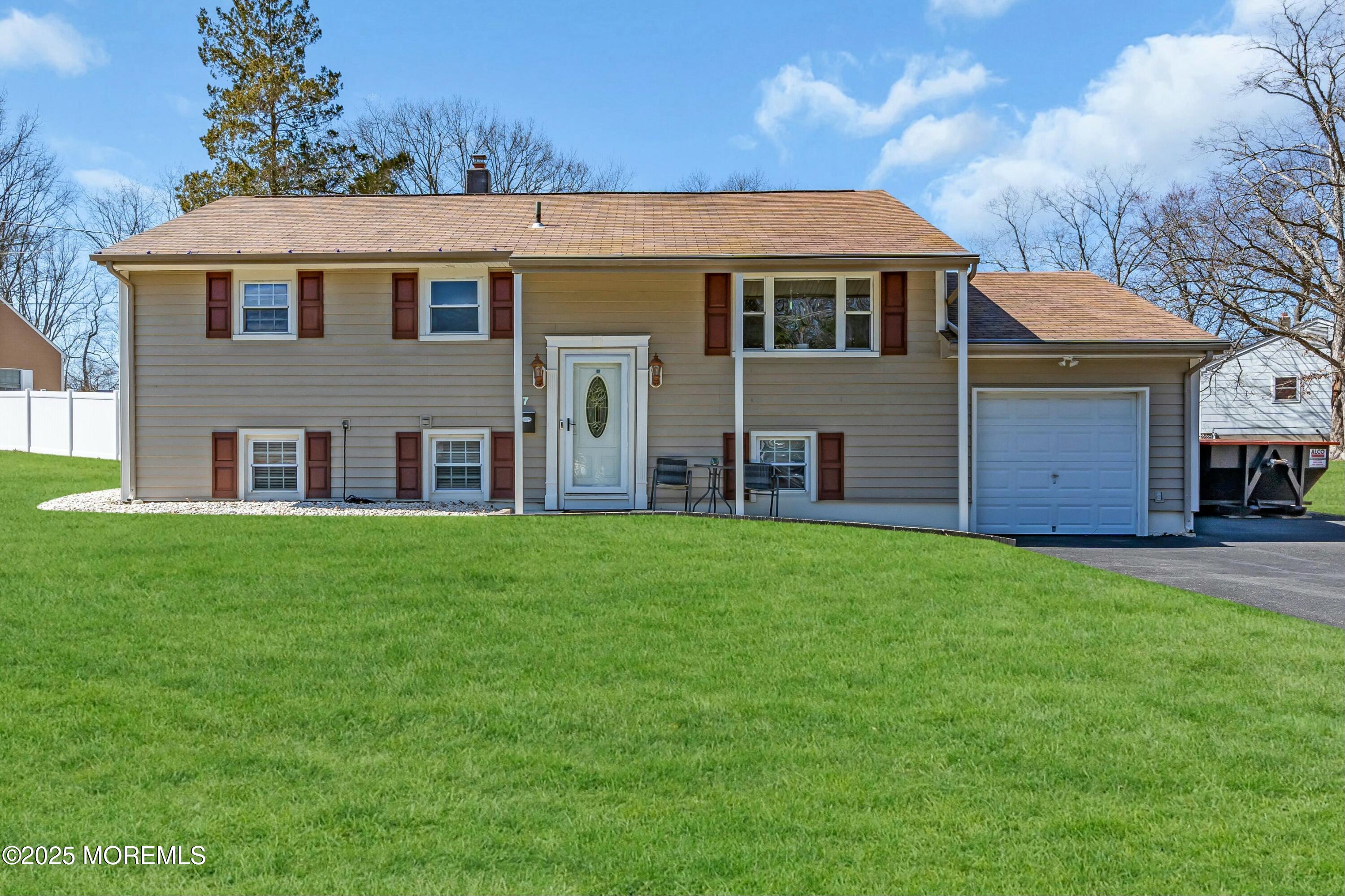7 Southgate Drive Howell, NJ 07731 - Photo 1 of 53 a front view of a house with a garden