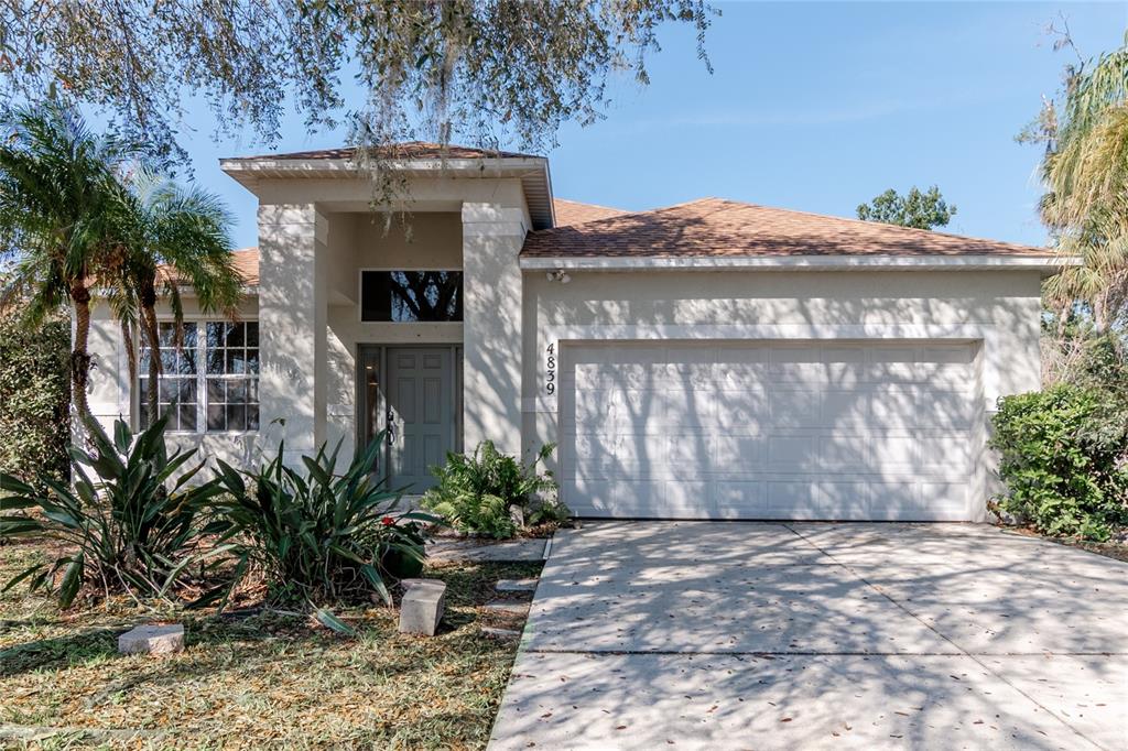 4839 Gardens Run Ellenton, FL 34222 - Photo 1 of 1 a front view of a house with garden