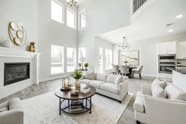 a view of an empty room with a window and fireplace