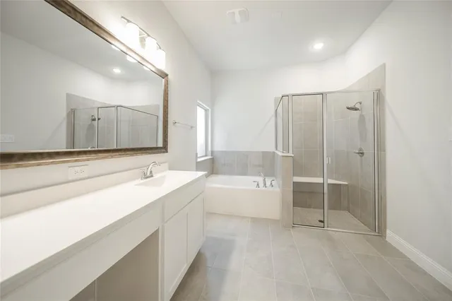 a kitchen with kitchen island a sink appliances and cabinets