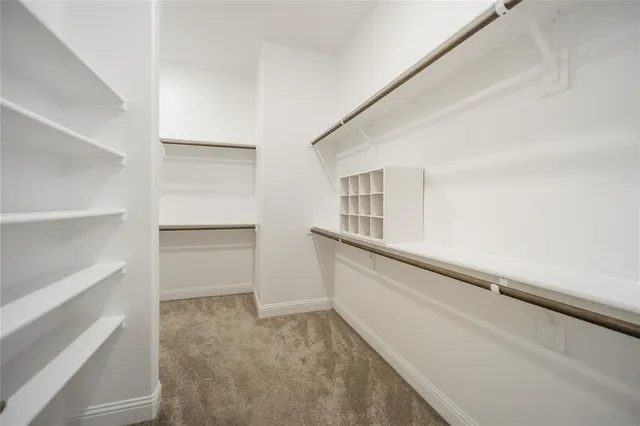 a bathroom with a double vanity sink mirror and bathtub