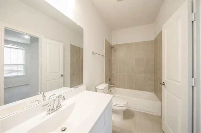 a bed room with a bed and a chair