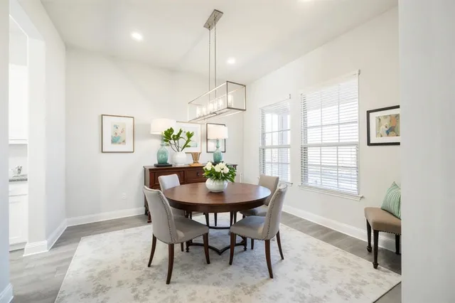 a dining room with furniture and window