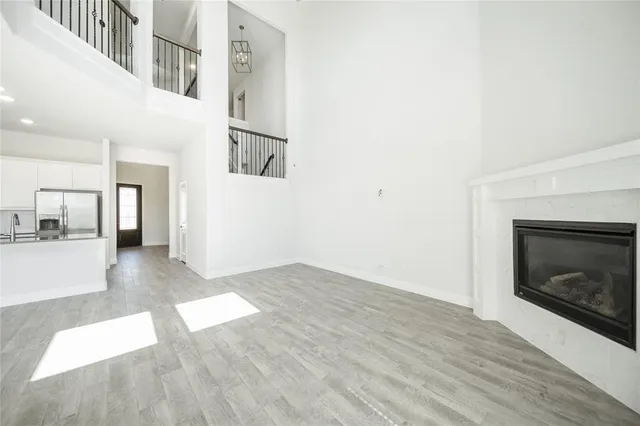 a view of kitchen with refrigerator and window