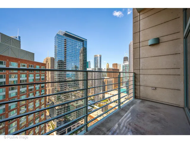 a view of a balcony with a floor to ceiling window