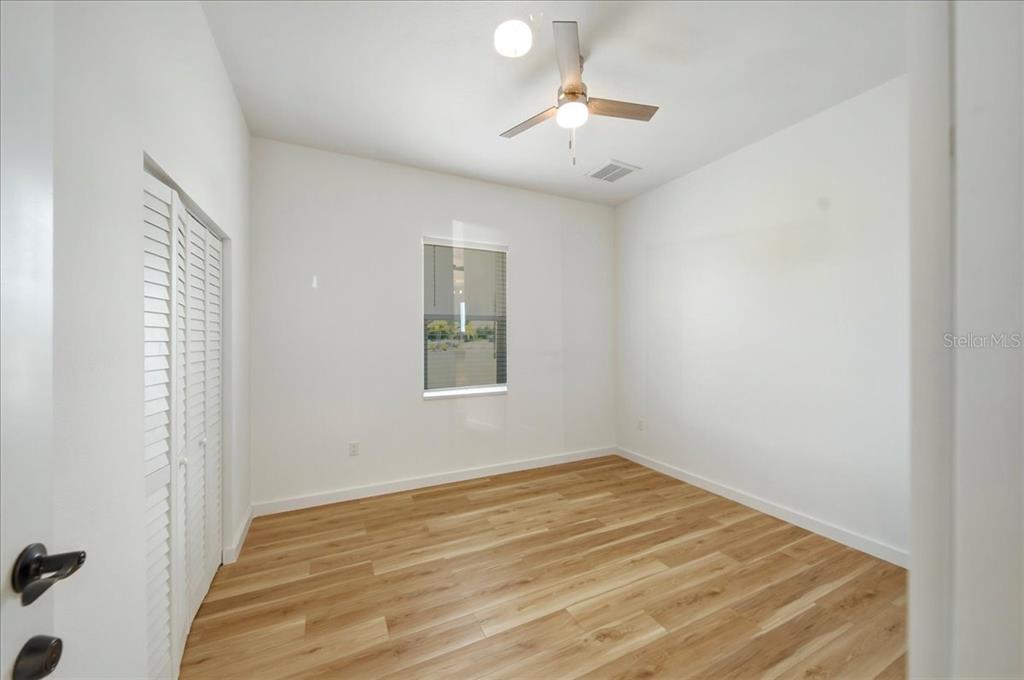 1215 Rio De Janeiro Avenue Punta Gorda, FL 33983 - Photo 15 of 65 a view of a room with a window and ceiling fan