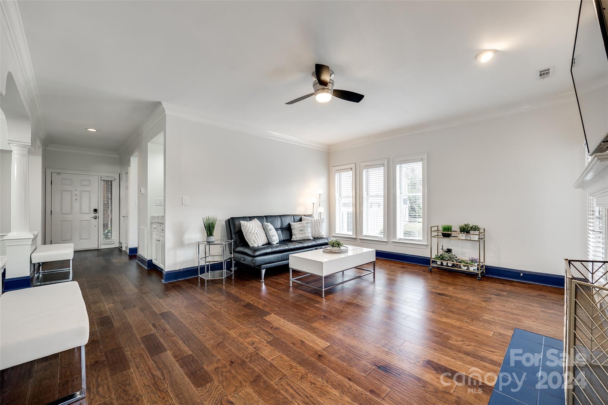 325 Queens Road Charlotte, NC 28204 - Photo 16 of 33 a living room with furniture and wooden floor