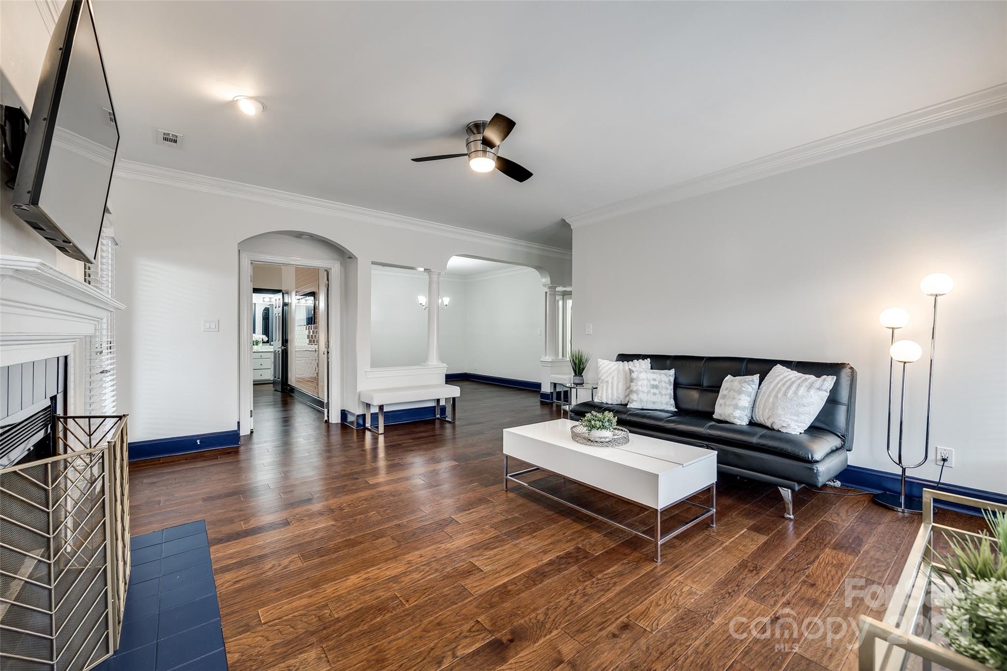 325 Queens Road Charlotte, NC 28204 - Photo 17 of 33 a living room with furniture and a flat screen tv