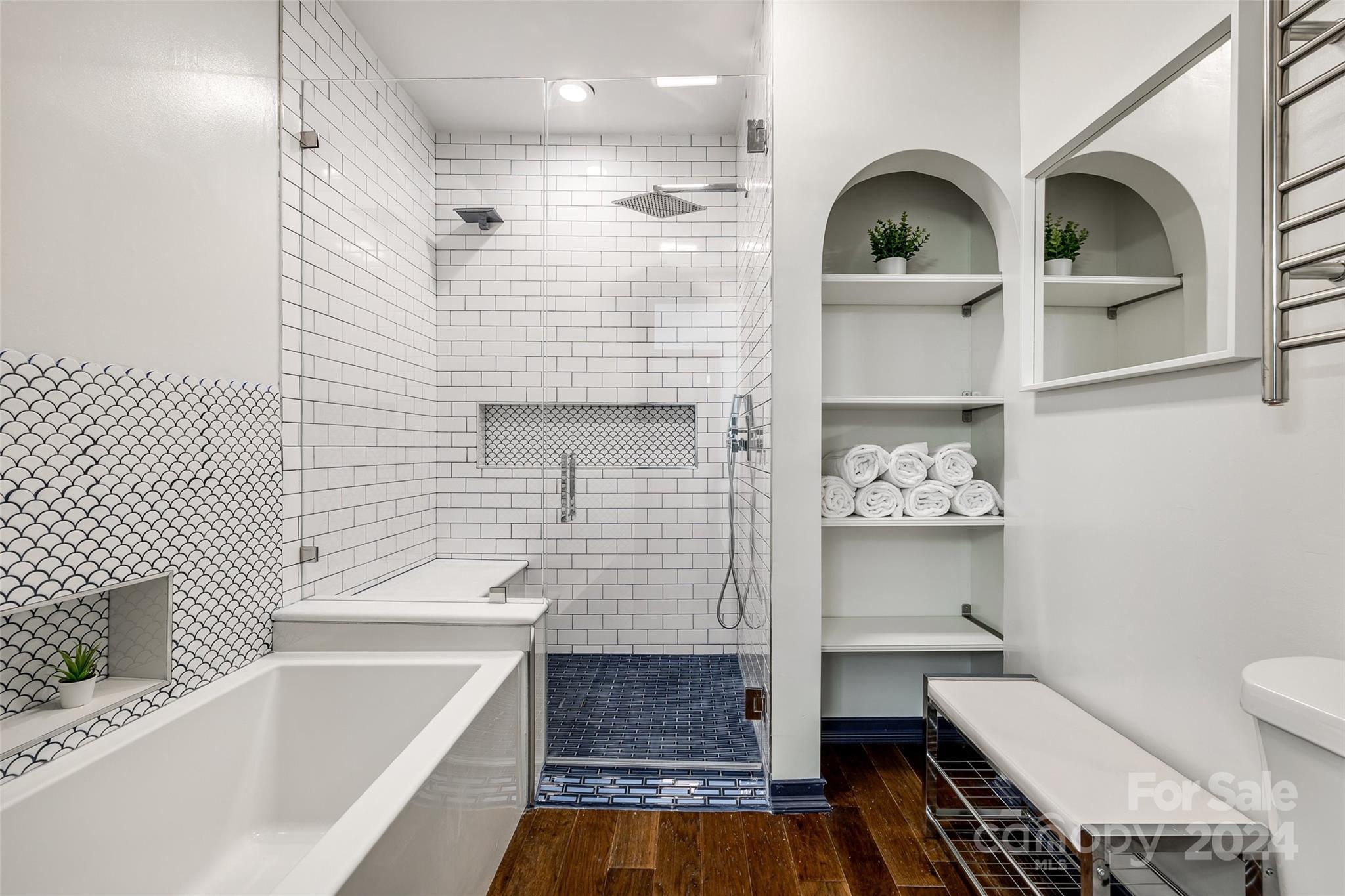 325 Queens Road Charlotte, NC 28204 - Photo 28 of 33 a bathroom with a sink a toilet and bathtub