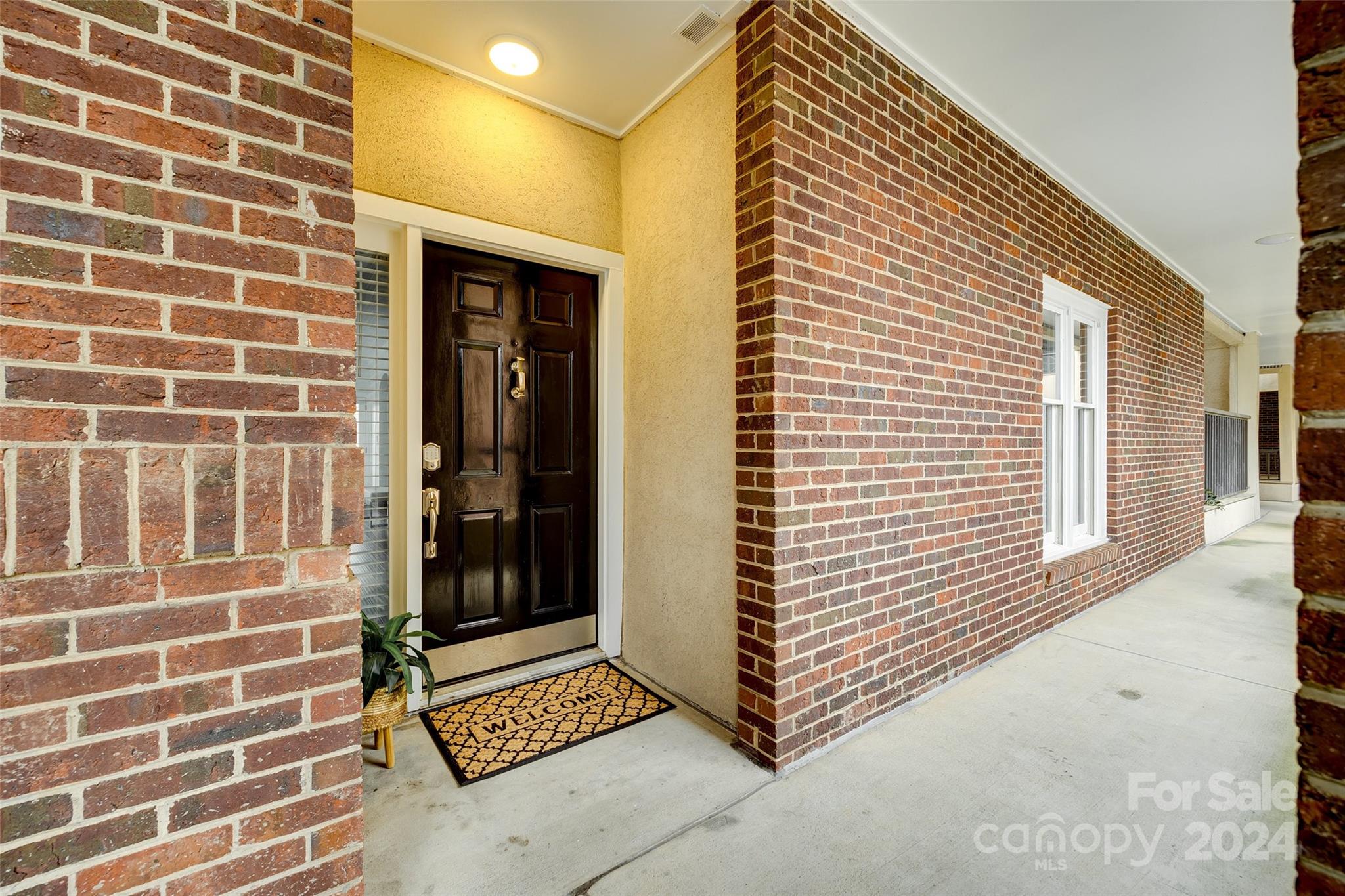 325 Queens Road Charlotte, NC 28204 - Photo 3 of 33 a view of a brick house with a door