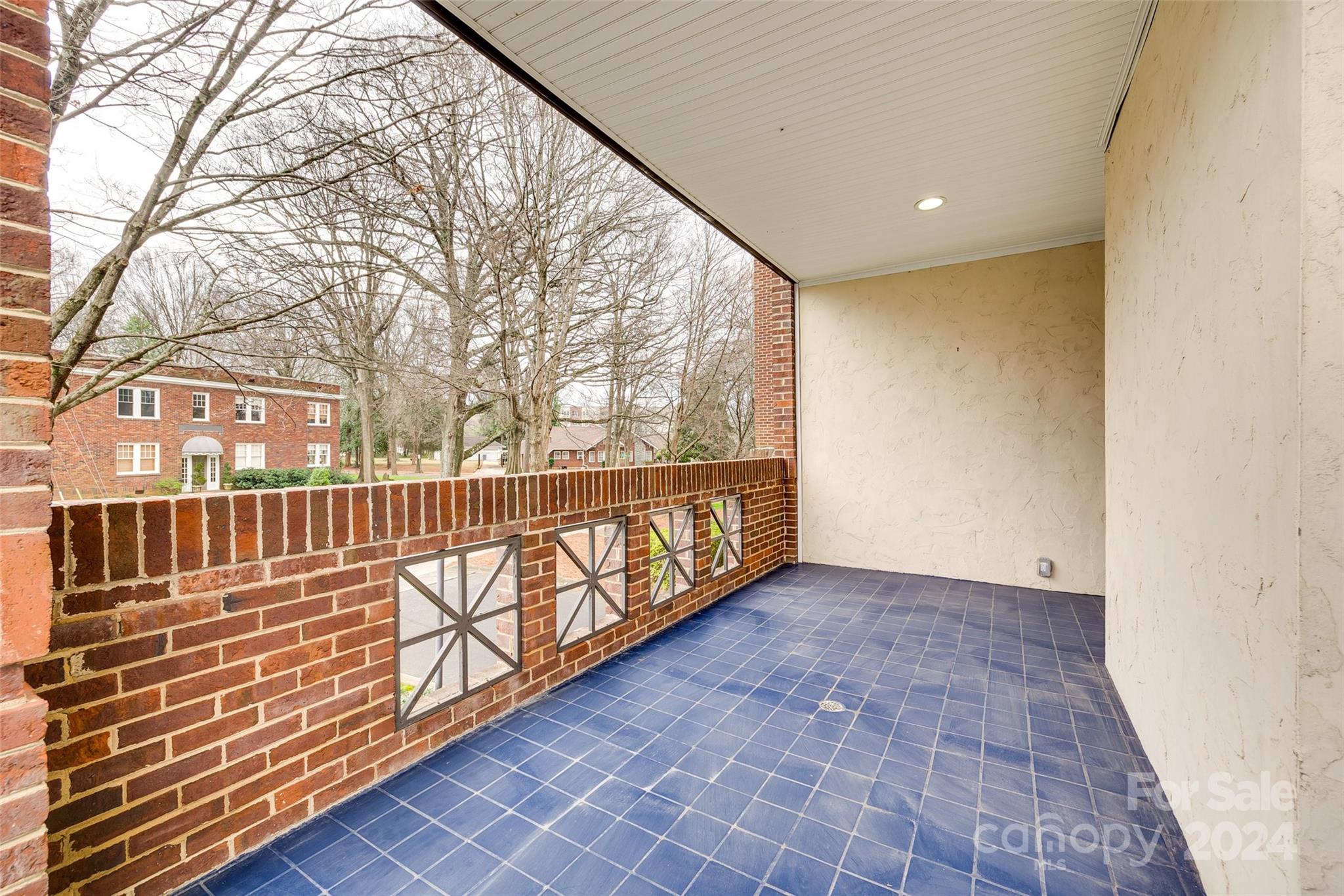 325 Queens Road Charlotte, NC 28204 - Photo 31 of 33 a view of an empty room with wooden floor and fence