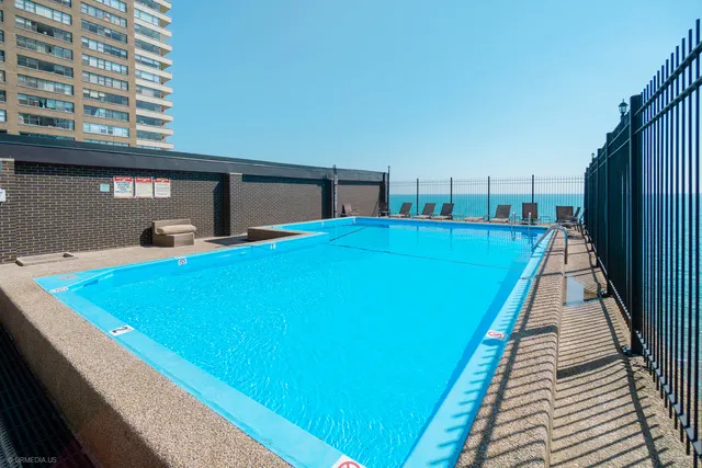 a view of a patio with chairs and a table