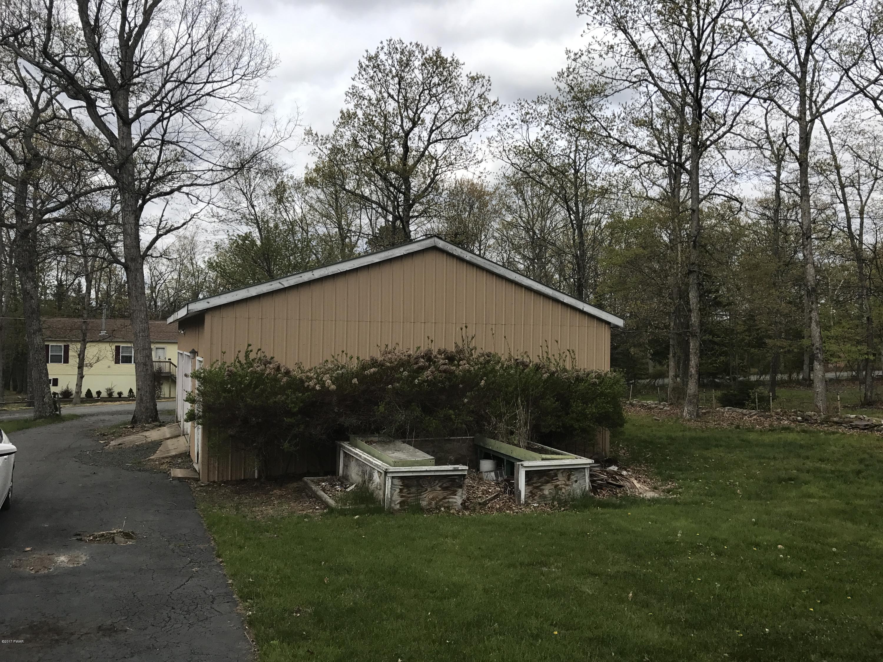 146 Weasel Road Dingmans Ferry, PA 18328 - Photo 12 of 15 a view of a house with backyard and trees