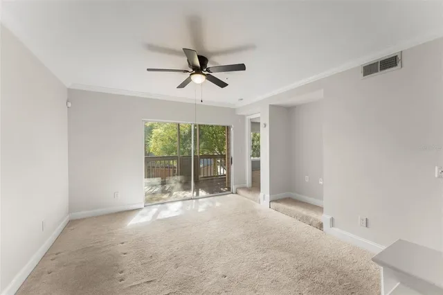 a view of room with a ceiling fan