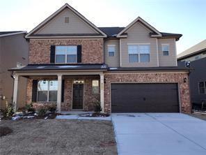 1215 Wesleyan Place Braselton, GA 30517 - Photo 1 of 1 a front view of a house with a yard and garage