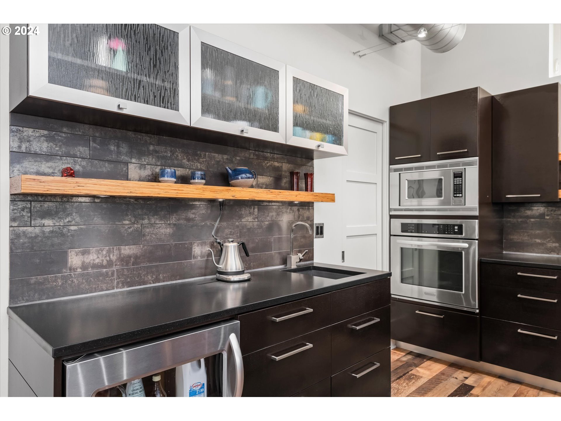 1261 Crenshaw Road Eugene, OR 97401 - Photo 20 of 48 a kitchen with a sink and cabinets