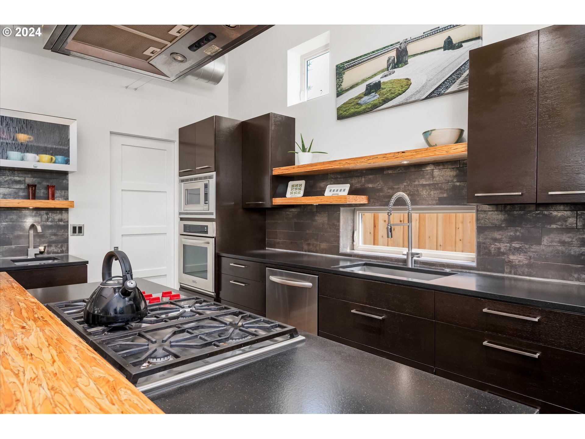 1261 Crenshaw Road Eugene, OR 97401 - Photo 24 of 48 a kitchen with stainless steel appliances granite countertop a stove and a sink