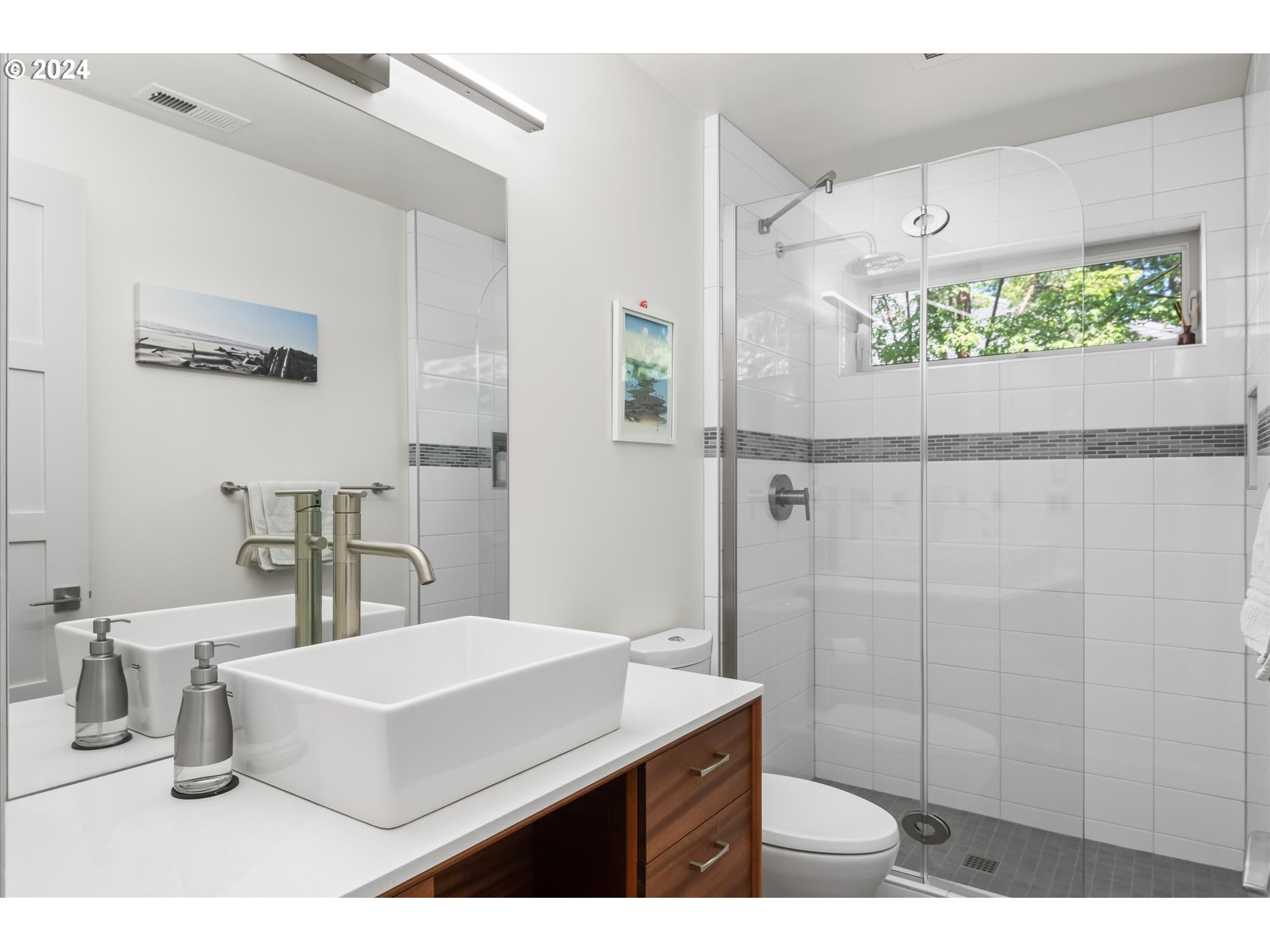 1261 Crenshaw Road Eugene, OR 97401 - Photo 36 of 48 a bathroom with a sink mirror and a shower