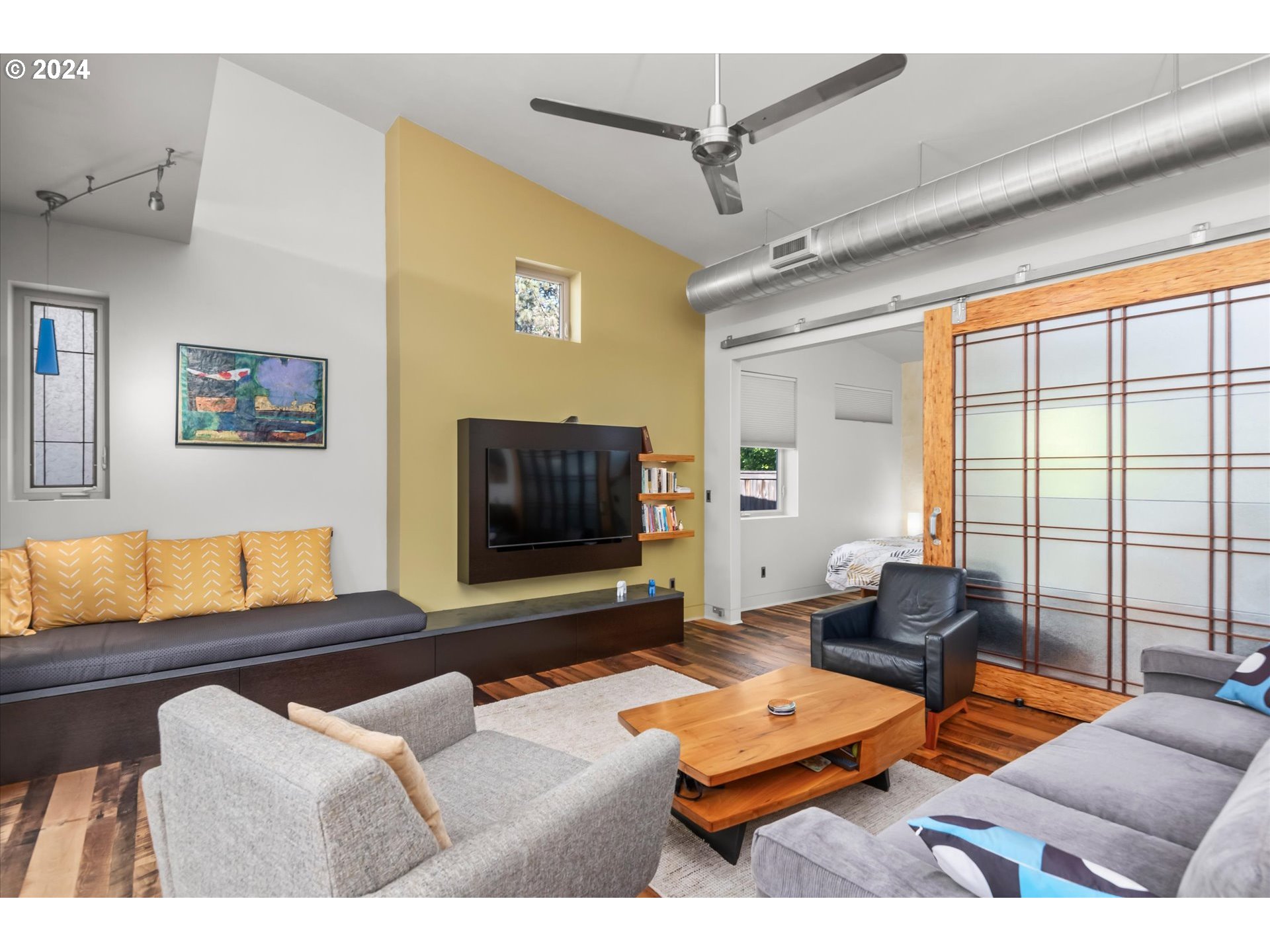 1261 Crenshaw Road Eugene, OR 97401 - Photo 10 of 48 a living room with furniture and a flat screen tv